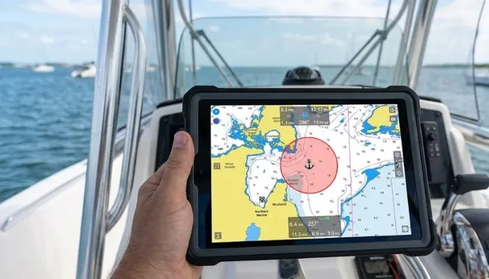 Aqua Map boat app displaying the anchor drag alarm circle feature on a tablet